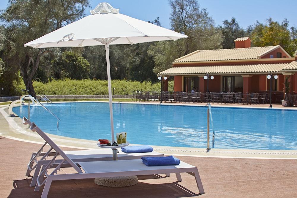Sentido Apollo Palace Mesongi Exterior photo A poolside lounge chair
