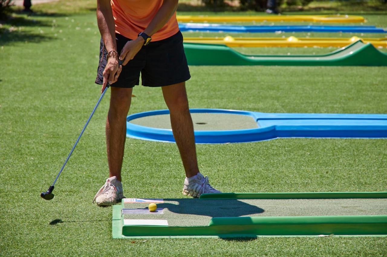 Sentido Apollo Palace Mesongi Exterior photo A player putting on a hole